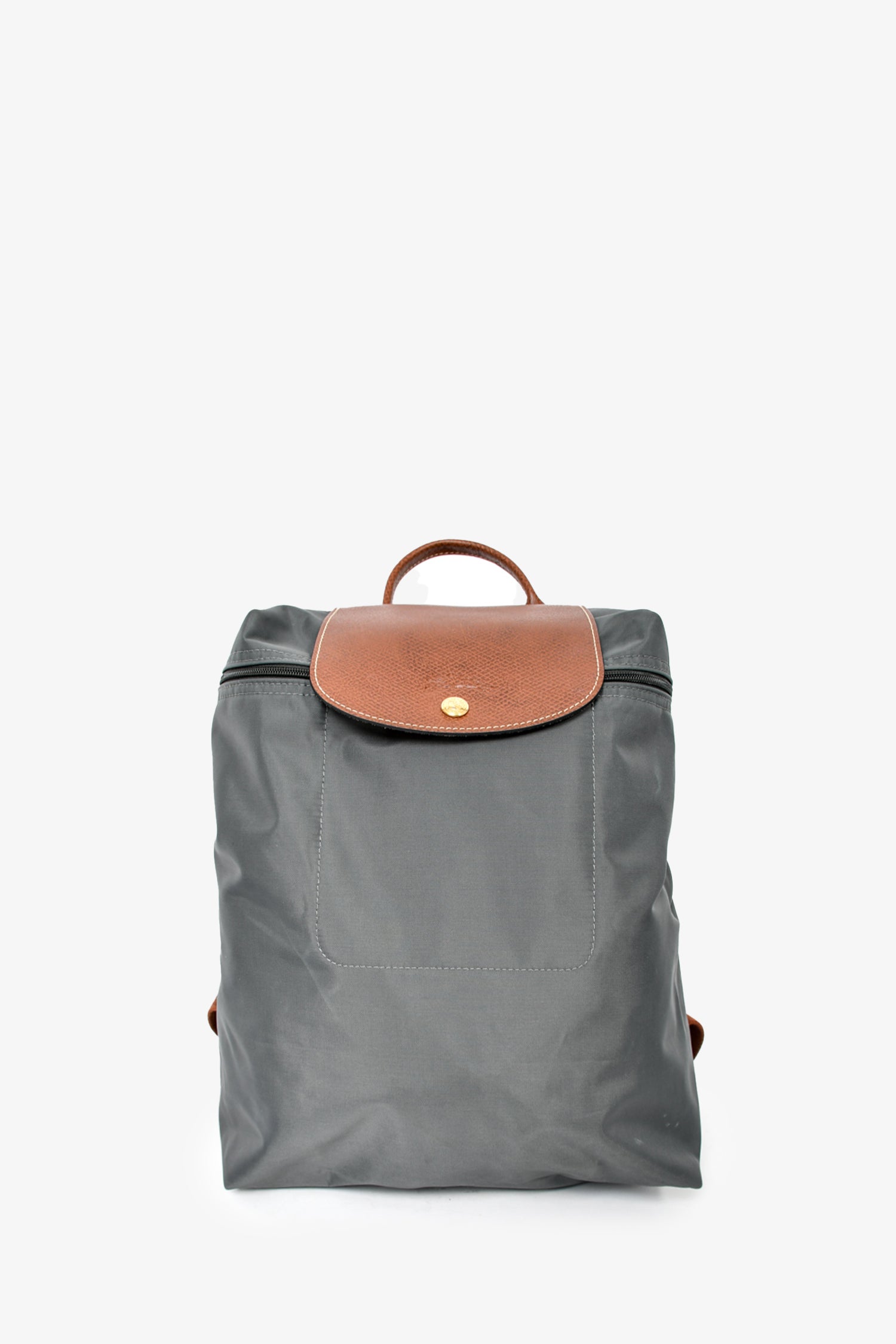 Longchamp Le Pliage backpack, gray nylon body, signature brown leather trim. Longchamp Le Pliage Backpack Review: My Go-To for Style  main image 3