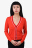 Pre-loved Chanel™ 2002 Orange Cashmere Sweater with Red Trim Size 38
