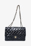 Pre-Loved Chanel™ 2008/09 Black Glitter Patent Leather Jumbo Single Flap Bag