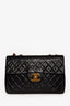 Pre-loved Chanel™ Black Lambskin Jumbo XL Maxi Flap