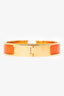 Hermès Gold-toned/Orange Enamel Clic Bracelet
