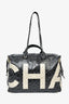 Sac de voyage Chanel en toile enduite noire et blanche avec camélias, collection 2017/18