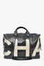 Sac de voyage Chanel en toile enduite noire et blanche avec camélias, collection 2017/18