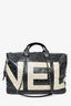 Sac de voyage Chanel en toile enduite noire et blanche avec camélias, collection 2017/18