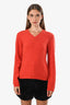 Pre-loved Chanel™ Orange Wool V-Neck Long Sleeve CC Sweater Estimated Size 36