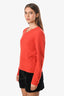 Pre-loved Chanel™ Orange Wool V-Neck Long Sleeve CC Sweater Estimated Size 36